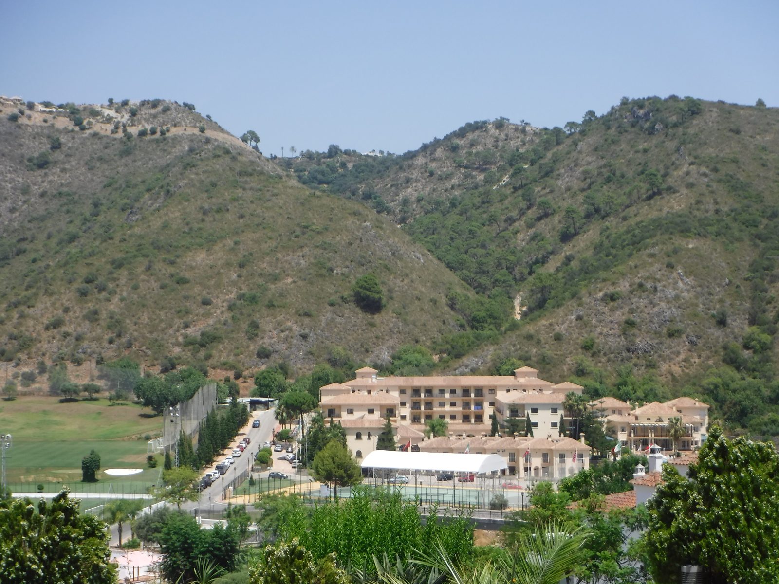 Benahavís hillside with low rise housing set into the valley
