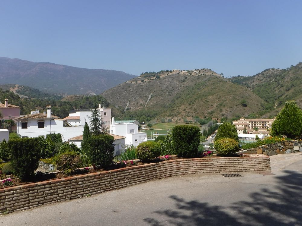 Benahavis white village rooftops above the valley