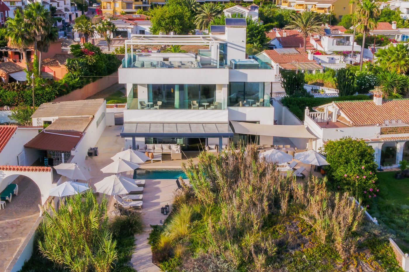 The tight grid of low houses in Costabella, Marbella, seen from above