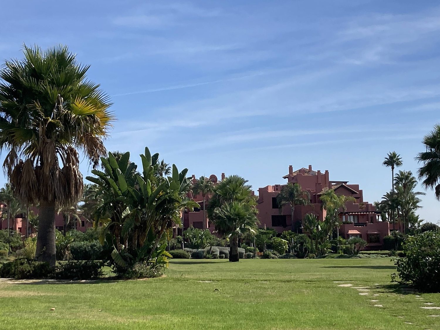 Gardens and apartment buildings in a residential development in Estepona