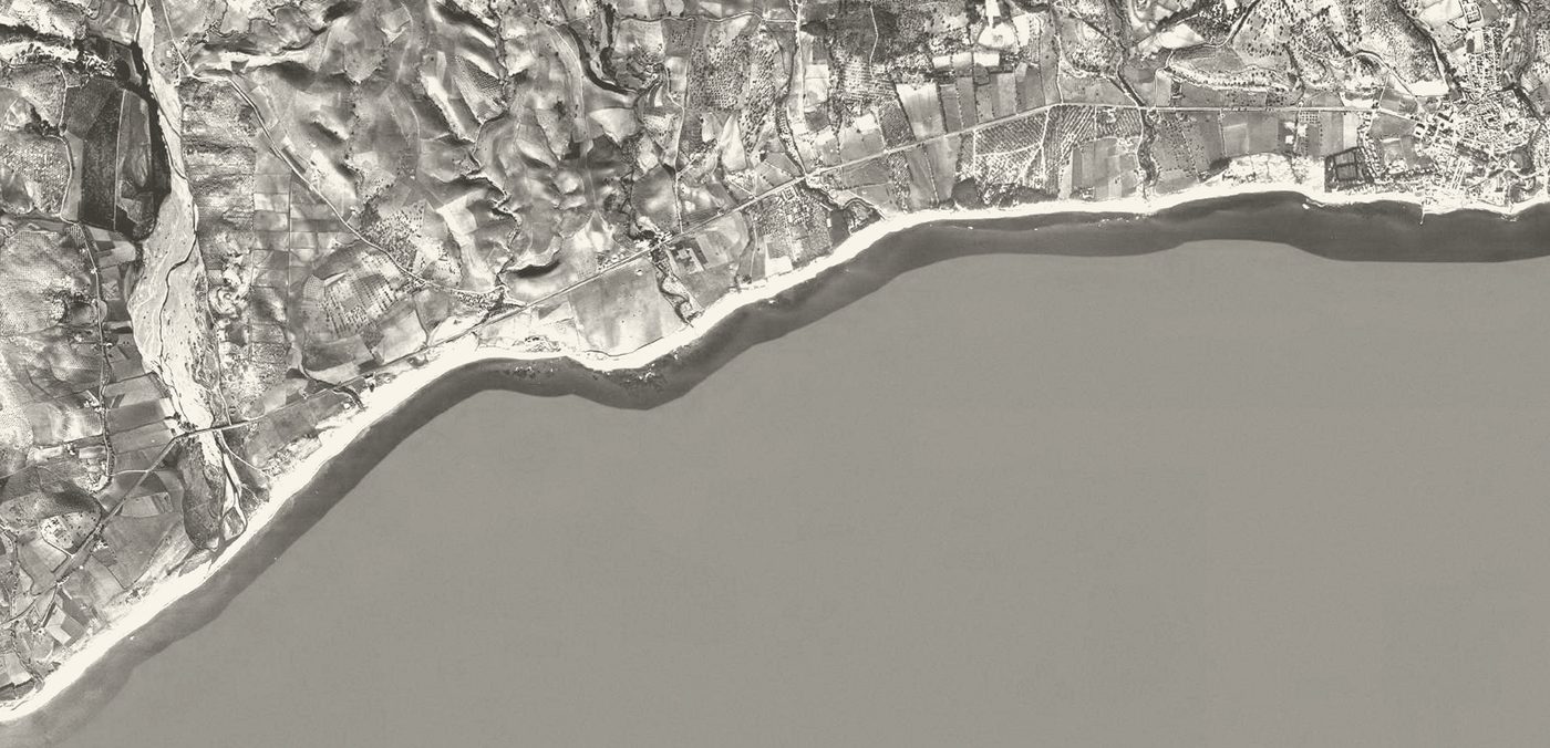 The Golden Mile coast in 1956, farmland and a dirt road along the shore