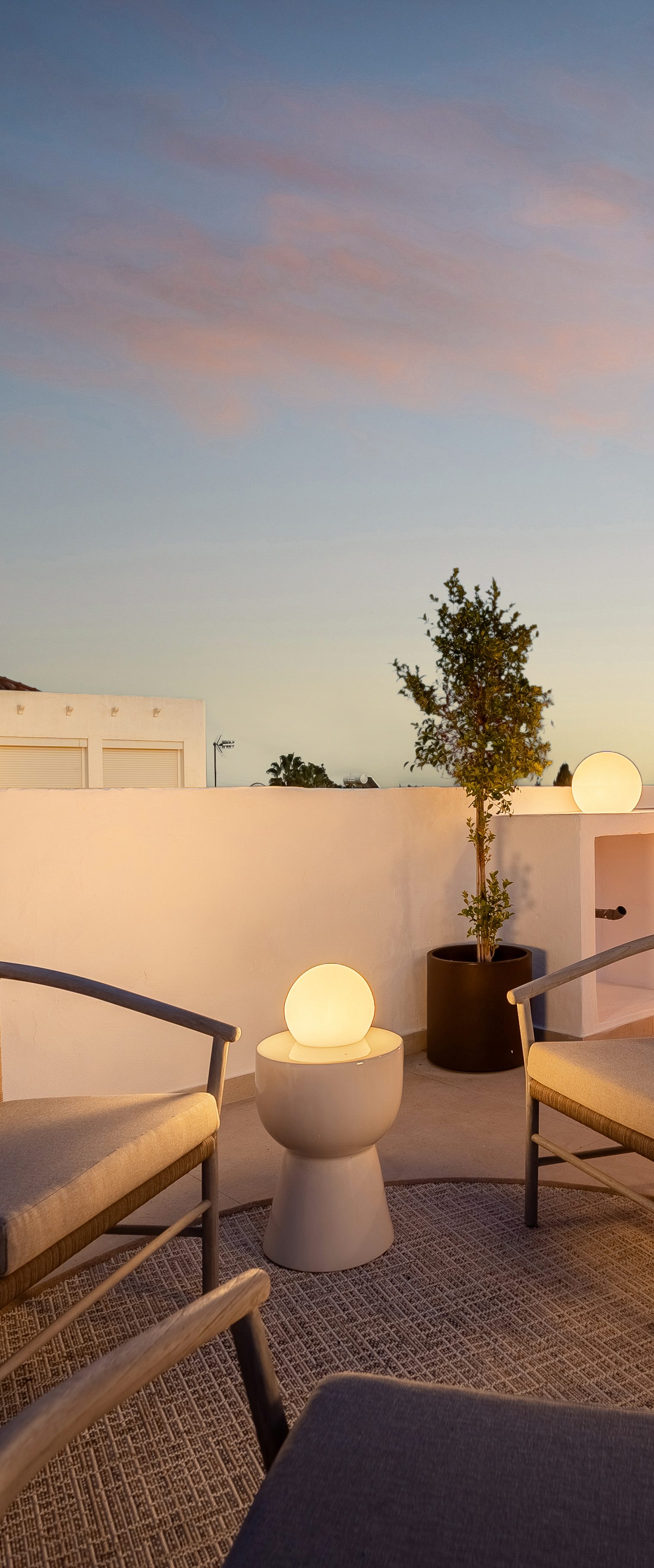 A roof terrace at dusk, Marbella