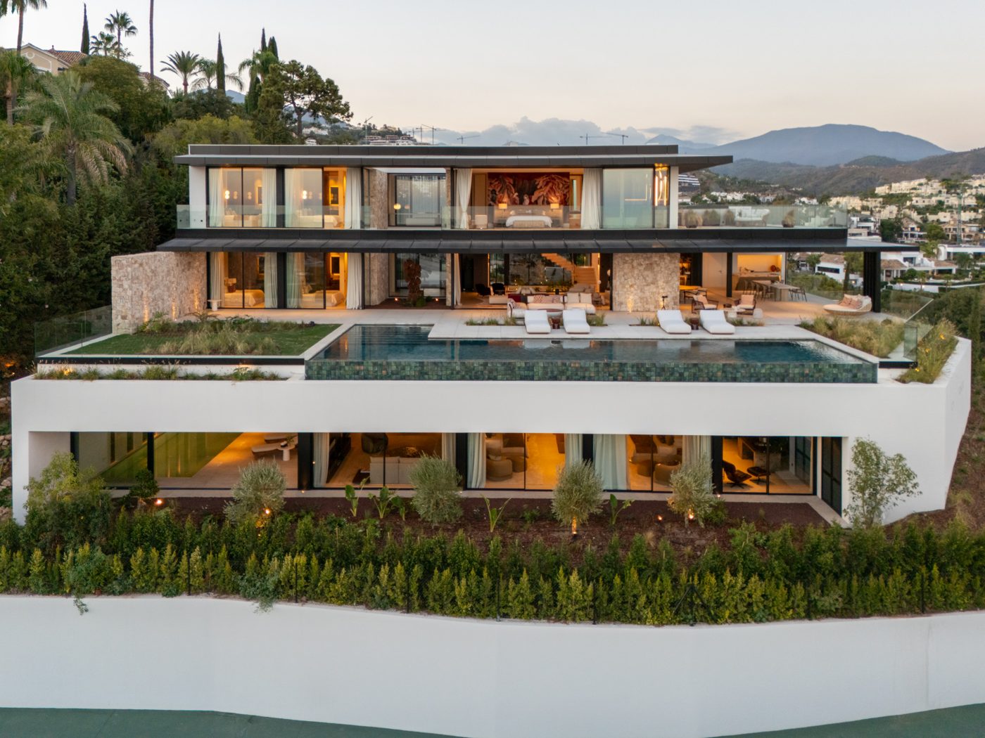 A villa on the slope above the La Quinta valley at dusk