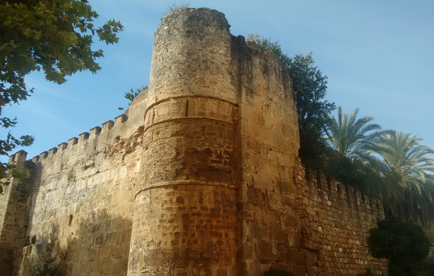 The round tower and crenellated wall of the castle in Marbella Old Town