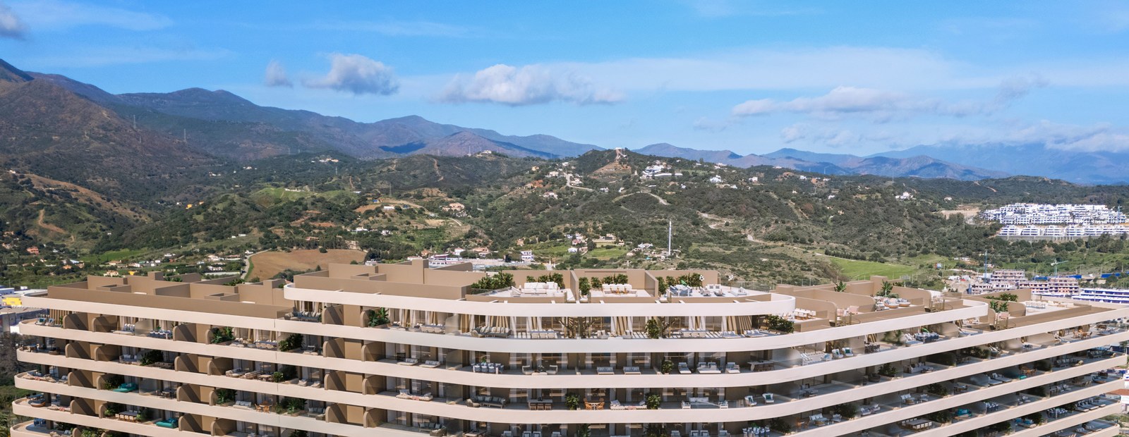 Apartment terraces in Marbella with the Sierra Blanca behind