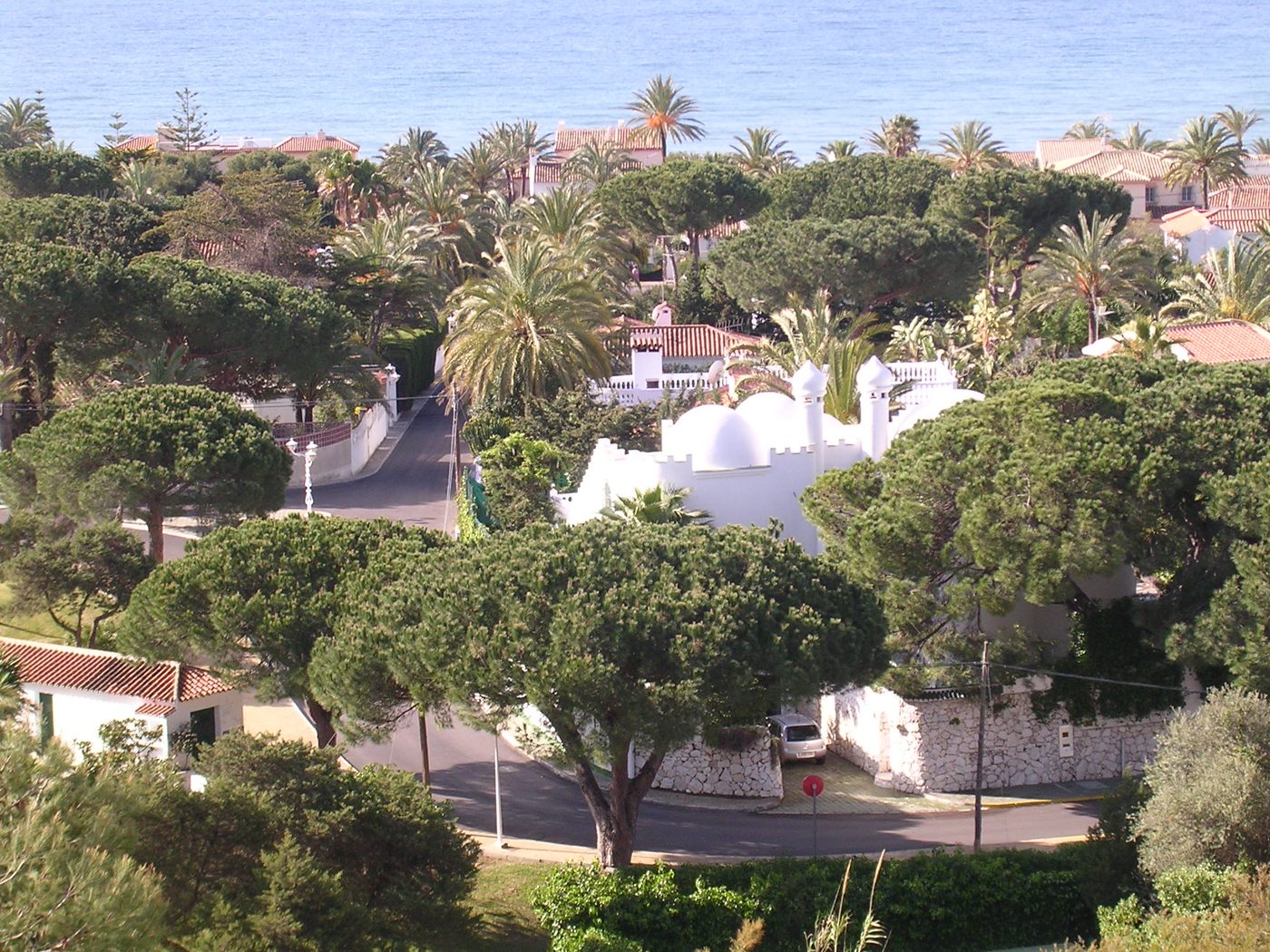 A street in Marbesa running down between the pines towards the sea
