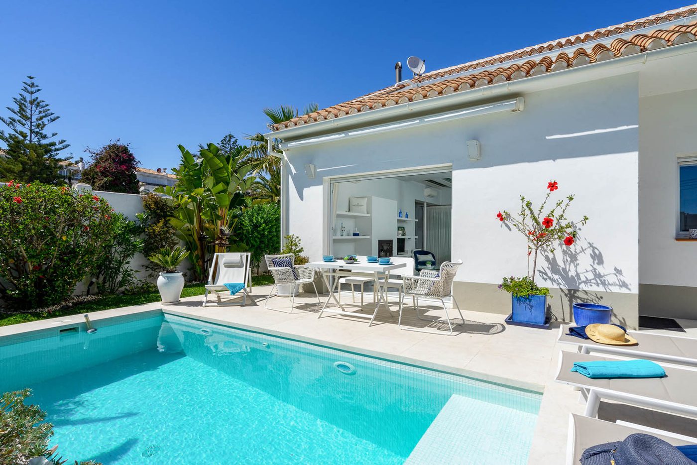 A single storey house at Marbesa opening onto its pool and garden