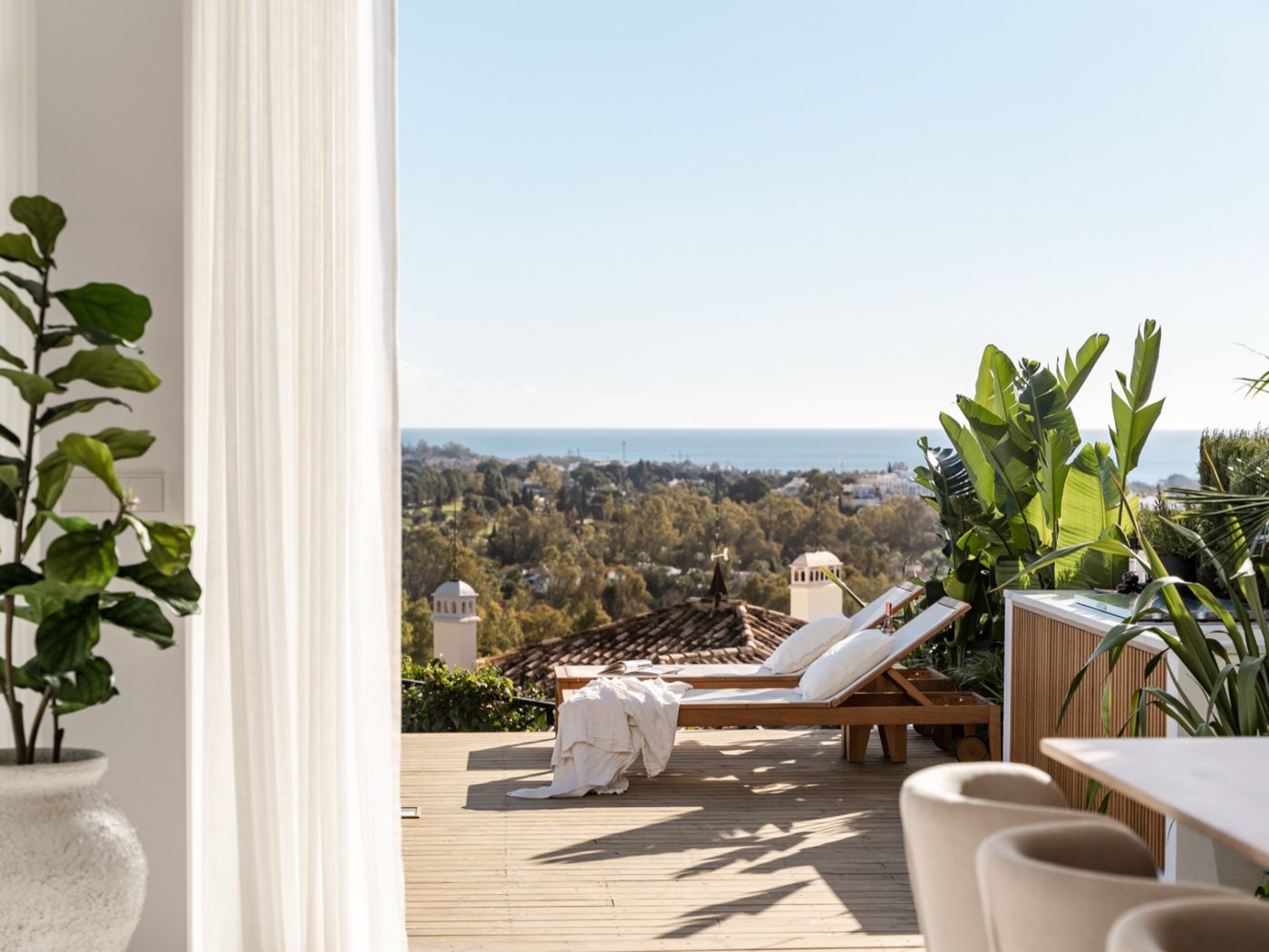 A terrace in Nueva Andalucía looking over the valley to the sea