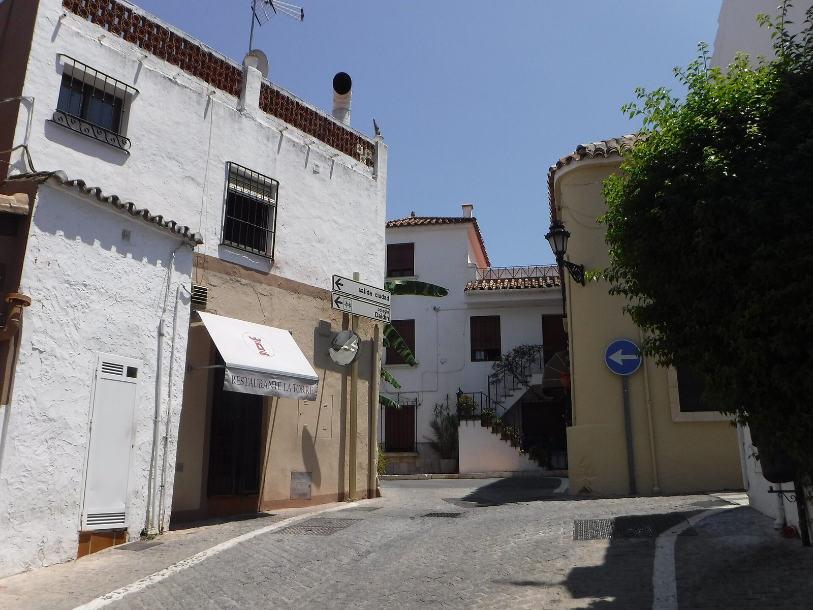 A narrow street in the village of Benahavís, near Creators International School