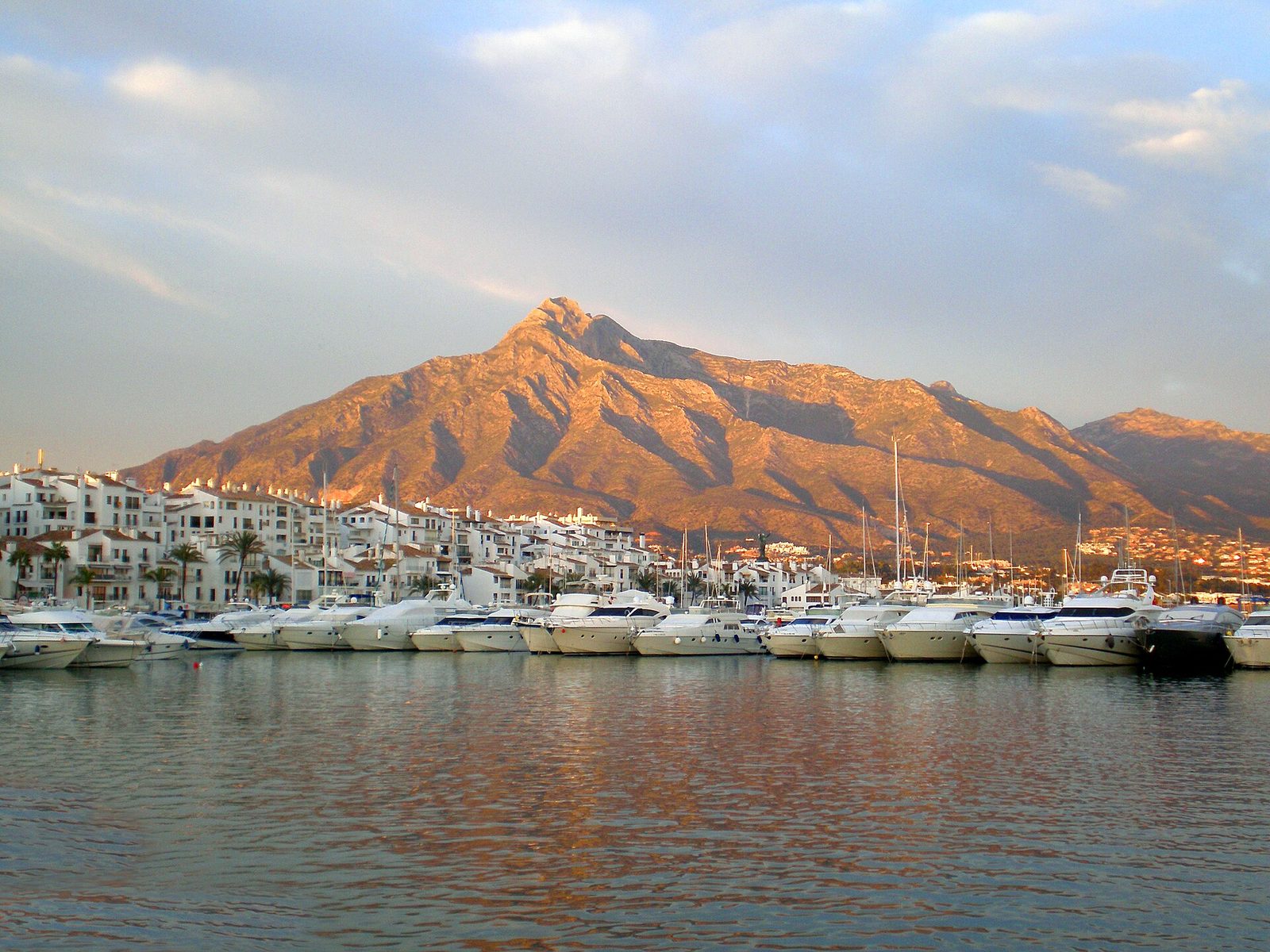 Puerto Banús marina with La Concha mountain behind, part of Marbella luxury property's Golden Mile