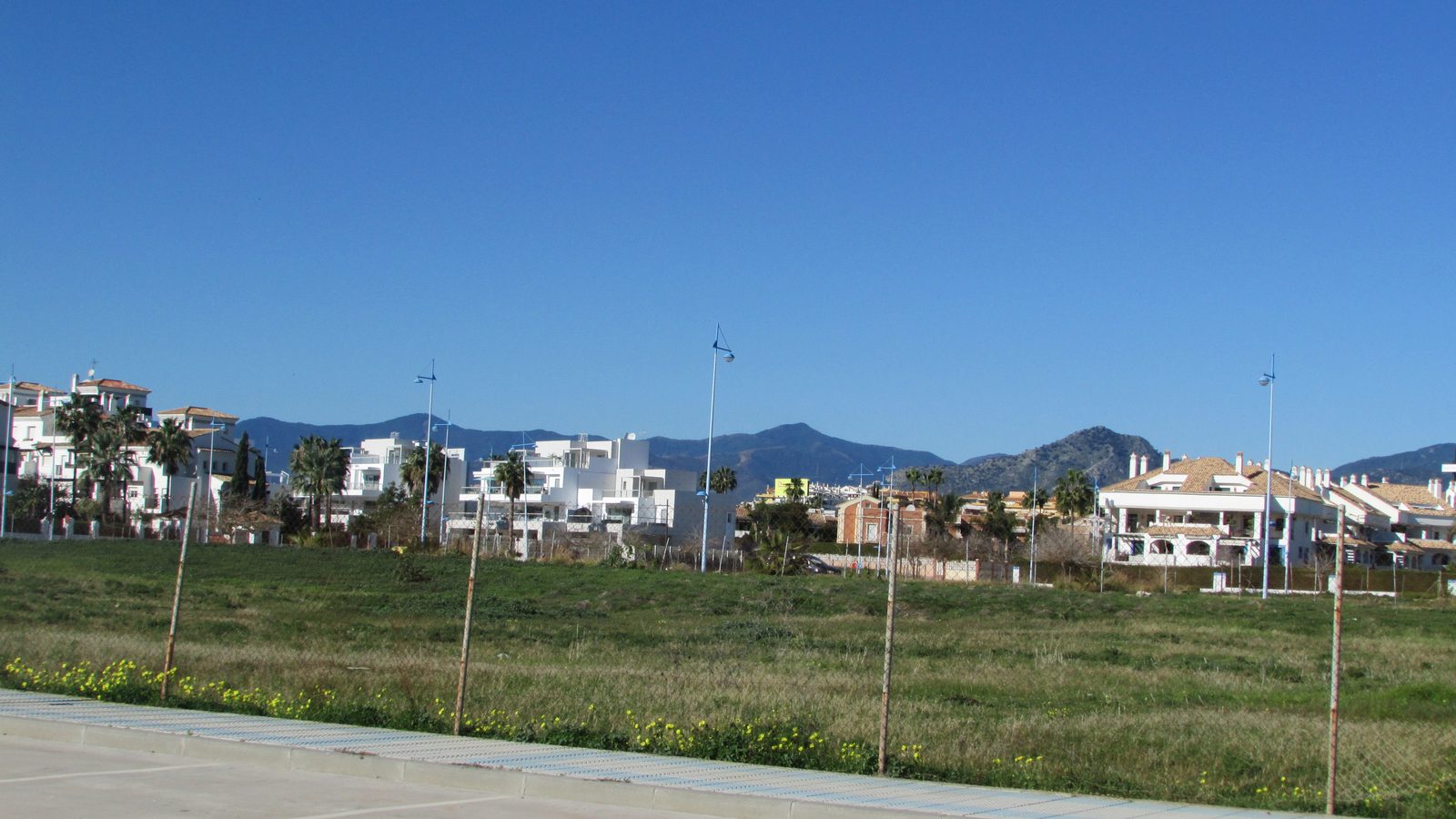 Modern housing development in San Pedro de Alcántara with mountains behind