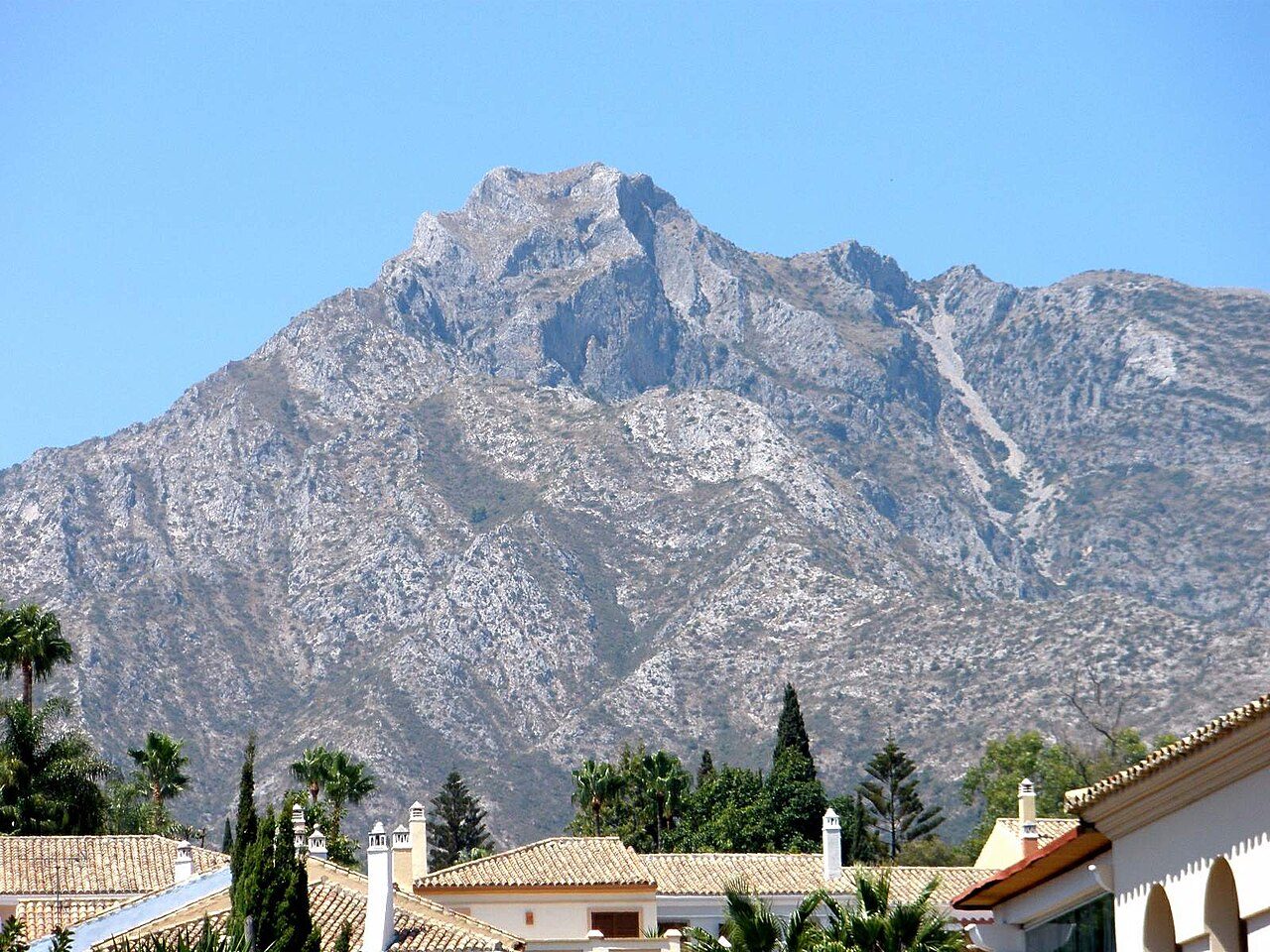 Sierra Blanca mountain peak rising behind rooftops in Marbella