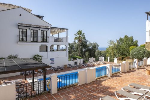 Mediterranean style south-facing triplex located in a gated community in Altos de Los Monteros, East Marbella