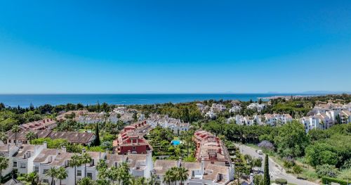 Panoramic Living Above Golf and Sea