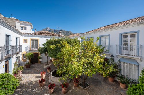 Charming townhouse with contemporary comfort in an Andalusian Mediterranean village on the Golden Mile.