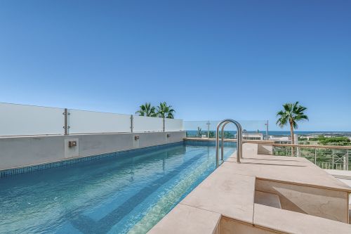 Elegant semi detached villa on Marbella's Golden Mile with a private rooftop pool, panoramic sea views and a private lift serving all four levels.